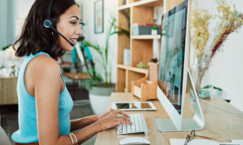 A young stylish woman working her remote customer service job